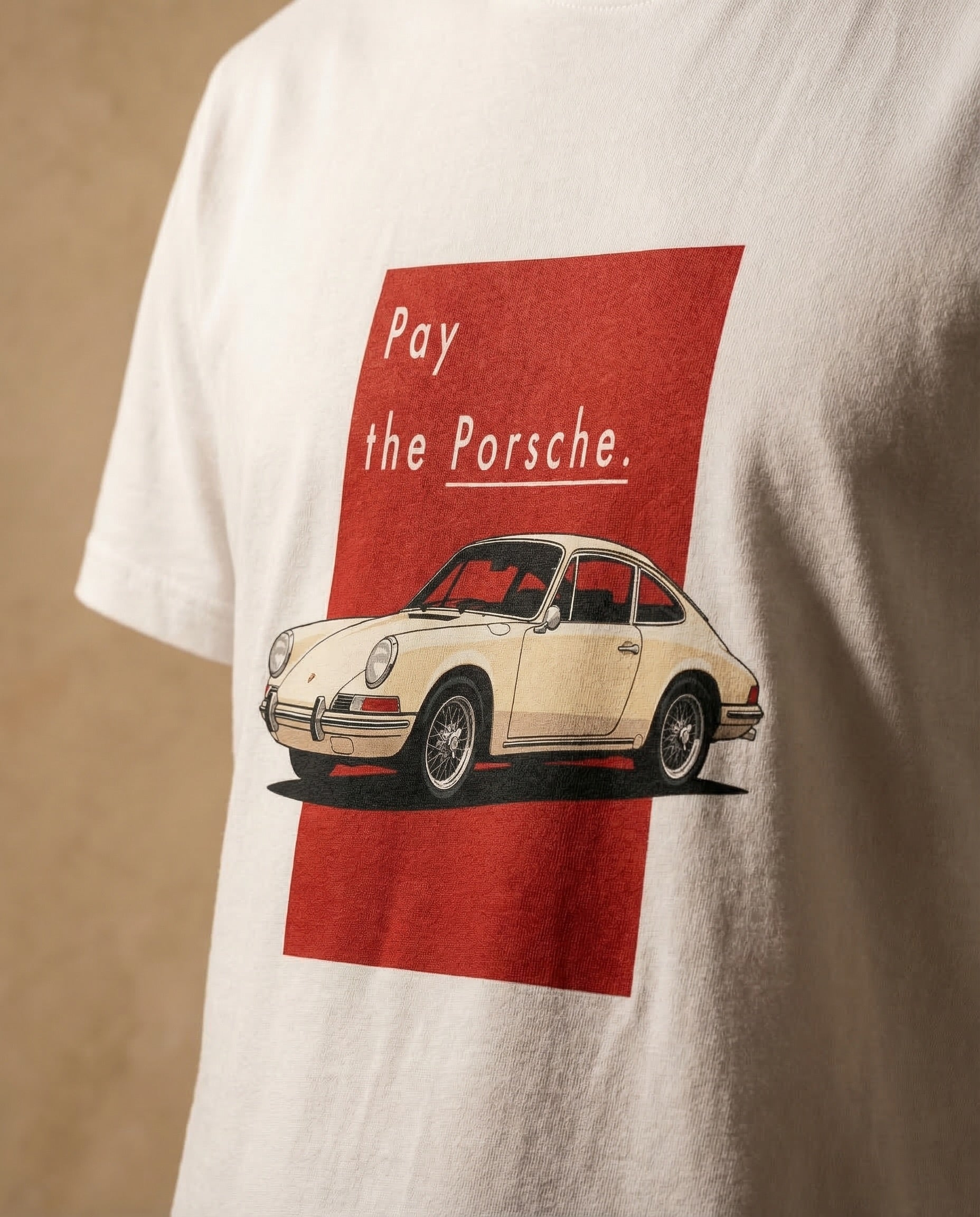 Unisex oversized "Pay the Porsche" print t-shirt by aurulu, featuring bold graphic design on soft fabric.