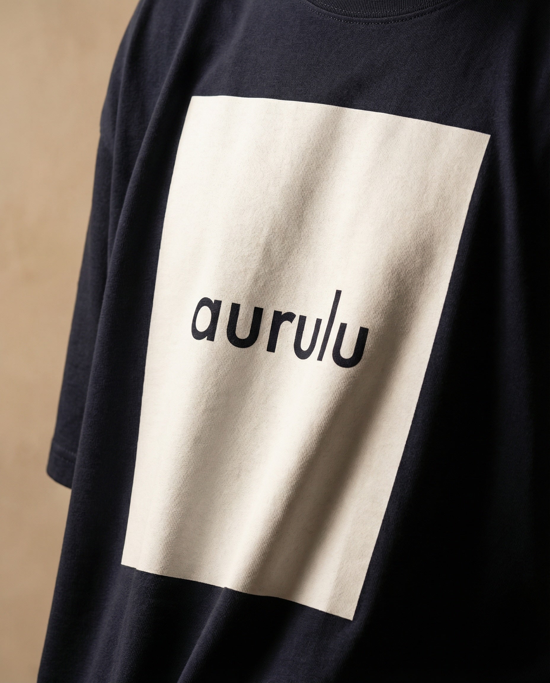 Aurulu men's oversized T-shirt with colorful print design, made from comfortable material, displayed flat on a white background.