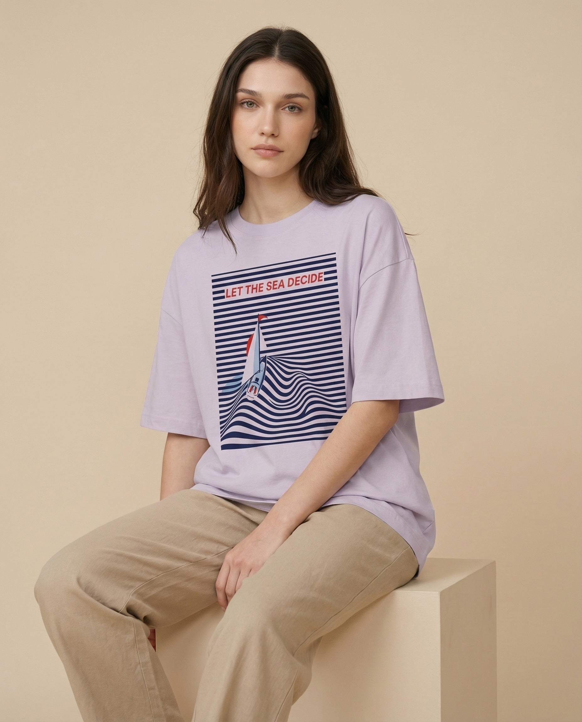 Women’s oversized "Let the Sea Decide" print tee by aurulu, featuring a relaxed fit and ocean-inspired design.