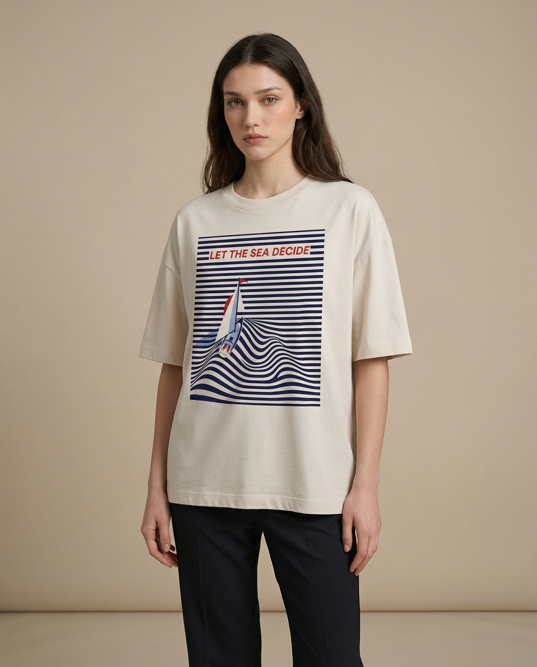 Women’s oversized “Let the Sea Decide” print tee by Aurulu, featuring a relaxed fit and ocean-inspired design.
