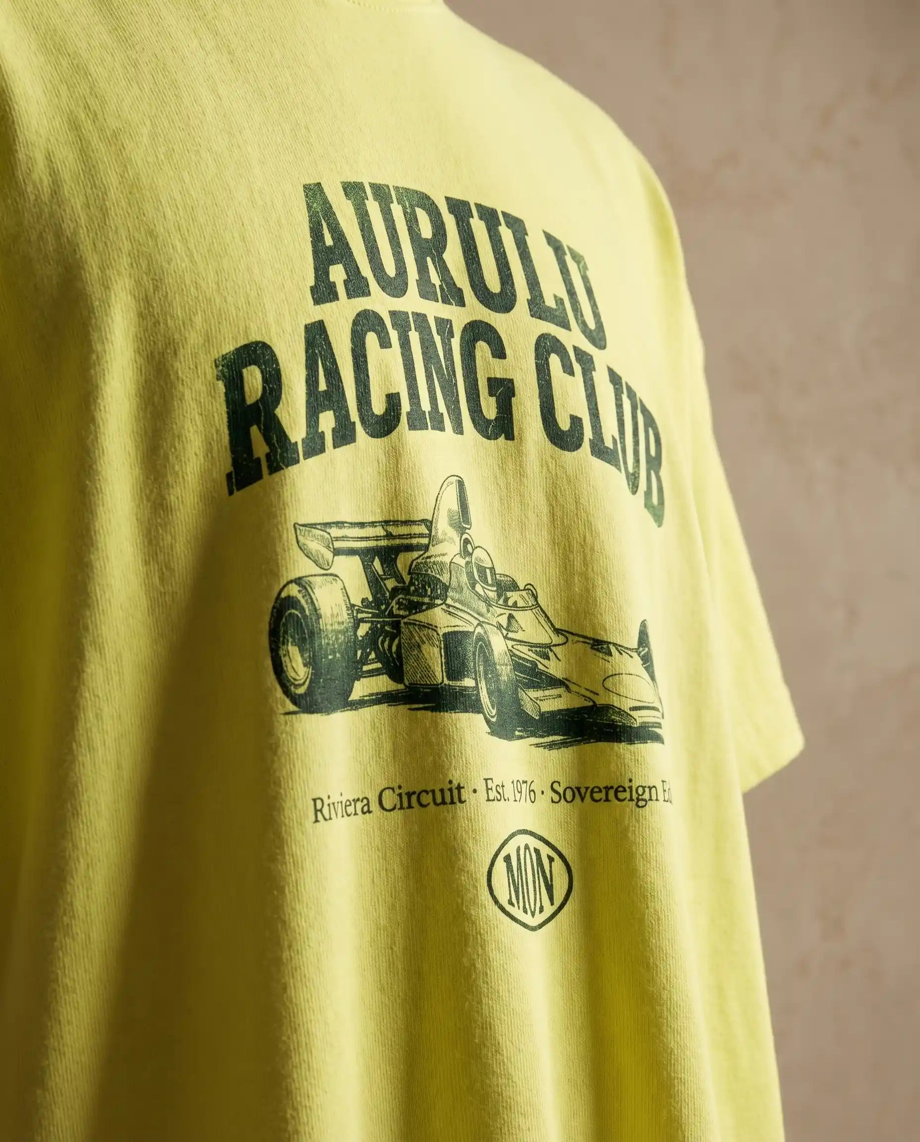 Aurulu Racing Club men's oversized print tee featuring bold racing-inspired graphic on soft fabric.