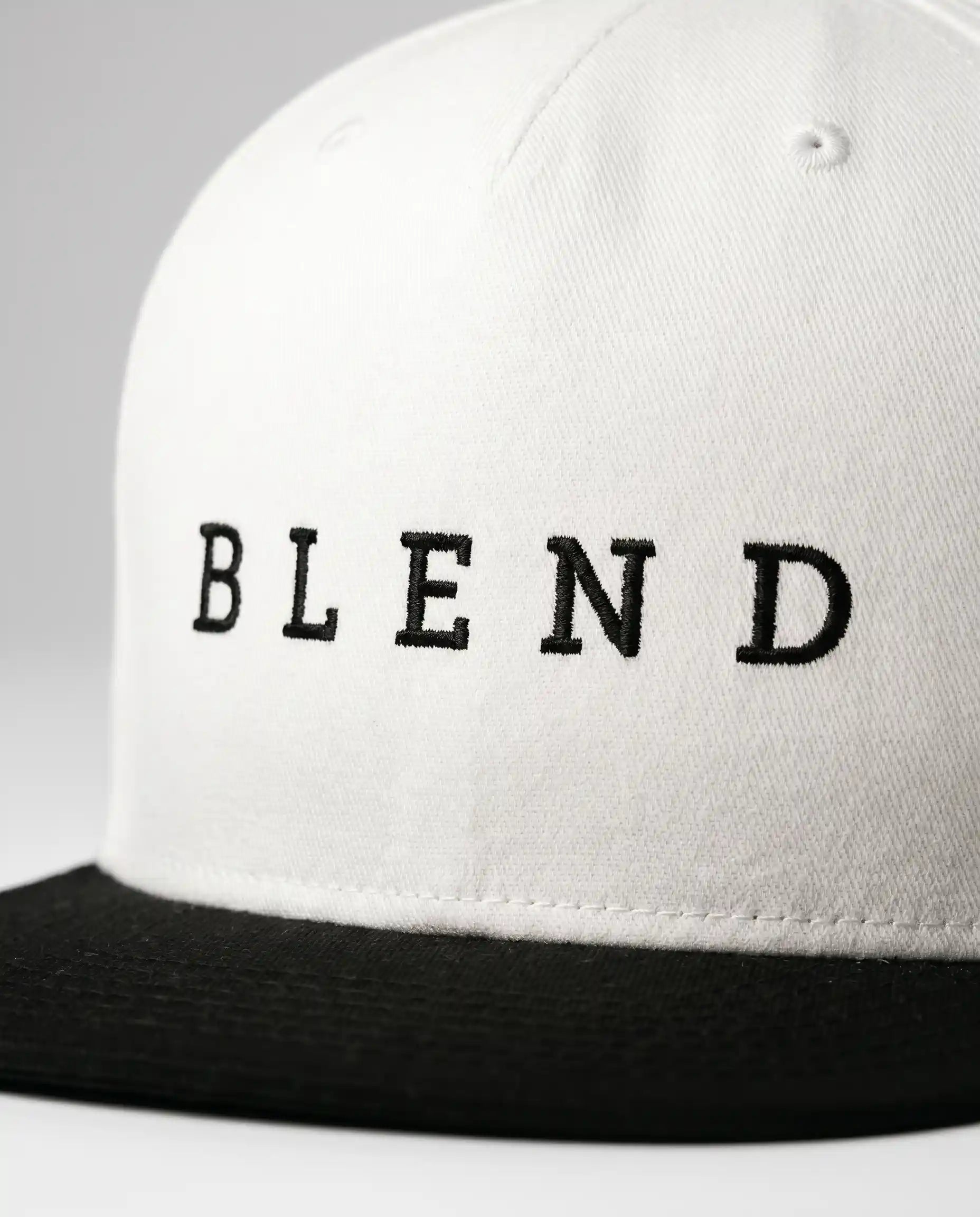 Aurulu Blend Snapback Cap with printed fabric design, featuring a structured black and white print material for casual style