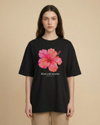 Aurulu Bloom With Intention women's oversized printed tee featuring a colorful floral design on soft fabric.
