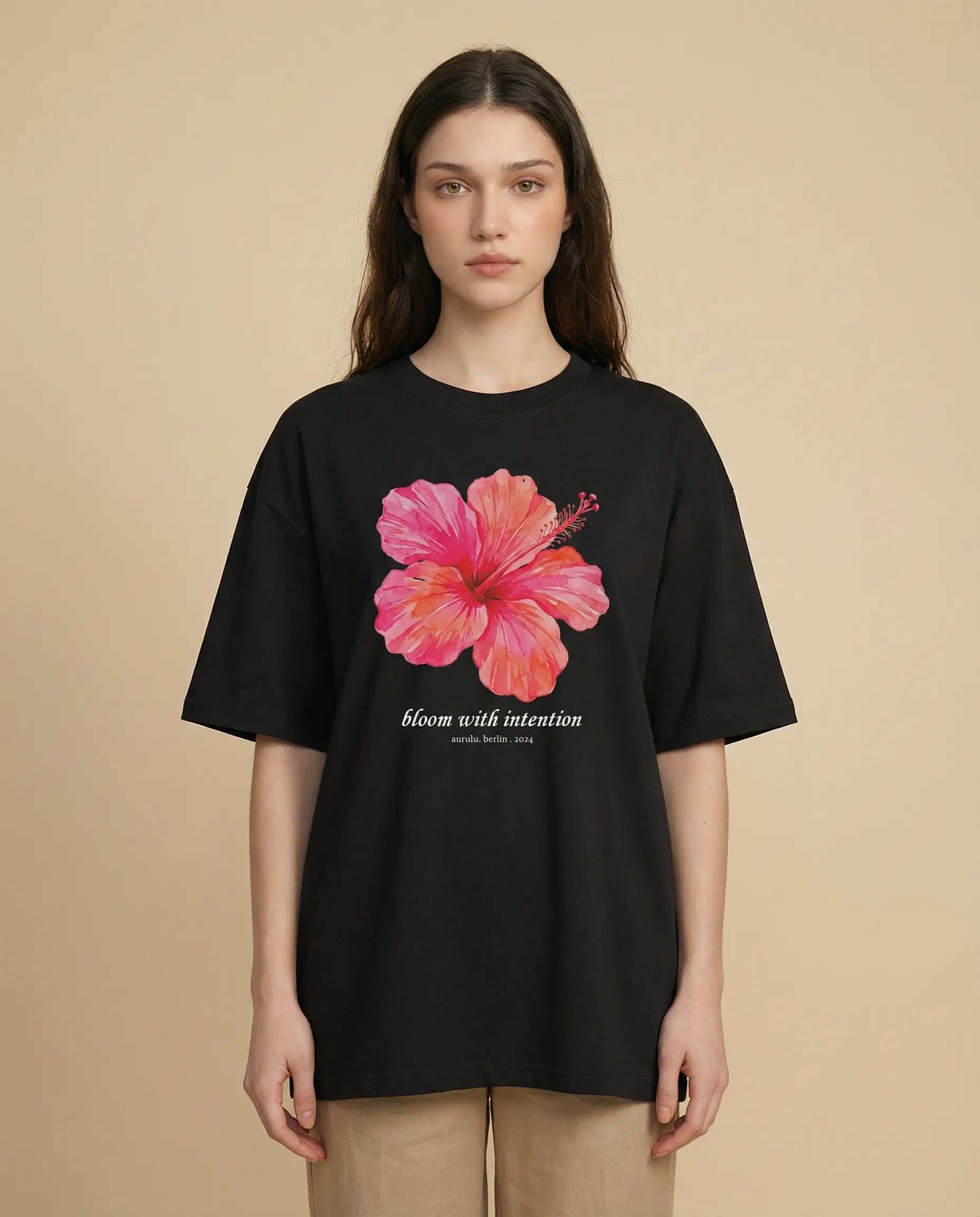 Aurulu Bloom With Intention women's oversized printed tee featuring a colorful floral design on soft fabric.