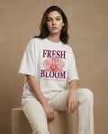 Fresh Bloom women's oversized tee with floral print, soft fabric and relaxed fit by aurulu, shown on a model.