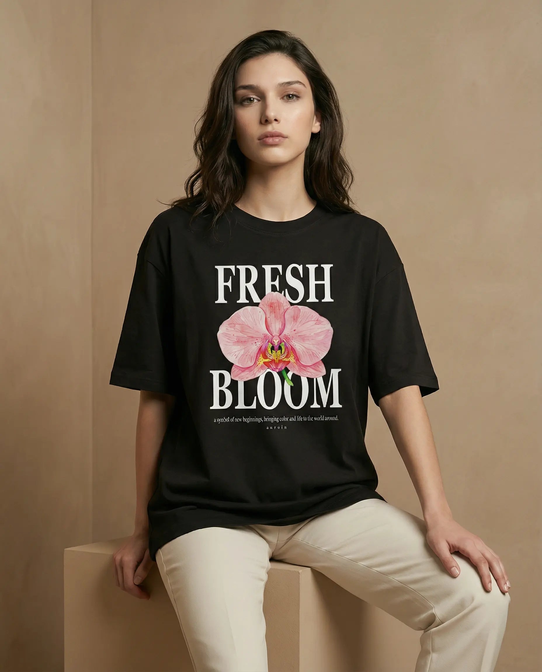 Fresh Bloom women's oversized t-shirt with floral print from aurulu, showcasing vibrant colors and relaxed fit on a white background.