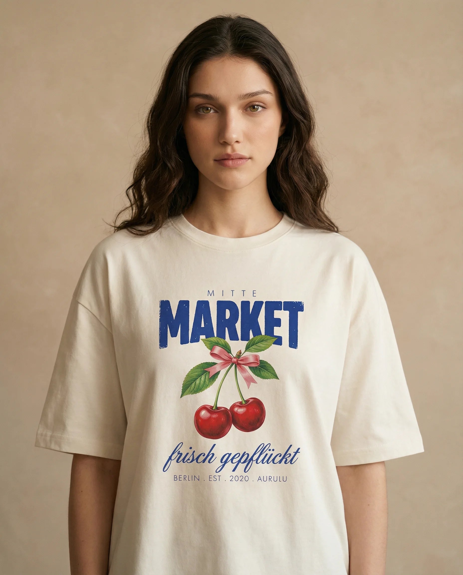 Aurulu Mitte Market women's oversized print tee featuring a colorful graphic design on soft fabric.