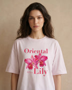 Oversized women's tee by aurulu featuring a vibrant oriental lily print on soft fabric.