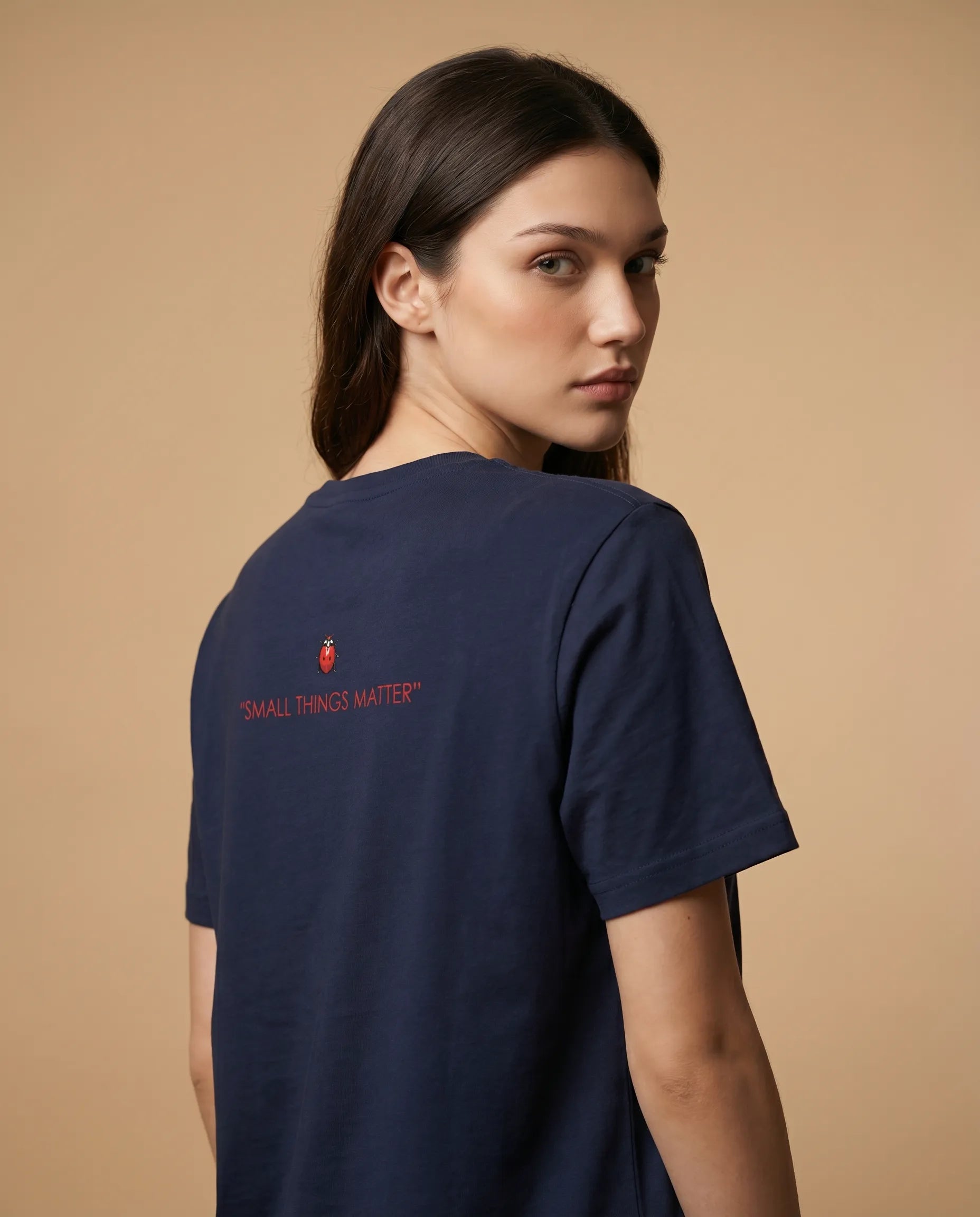Women's white print t-shirt by aurulu with "Small Things Matter" message, casual style, and comfortable fit.