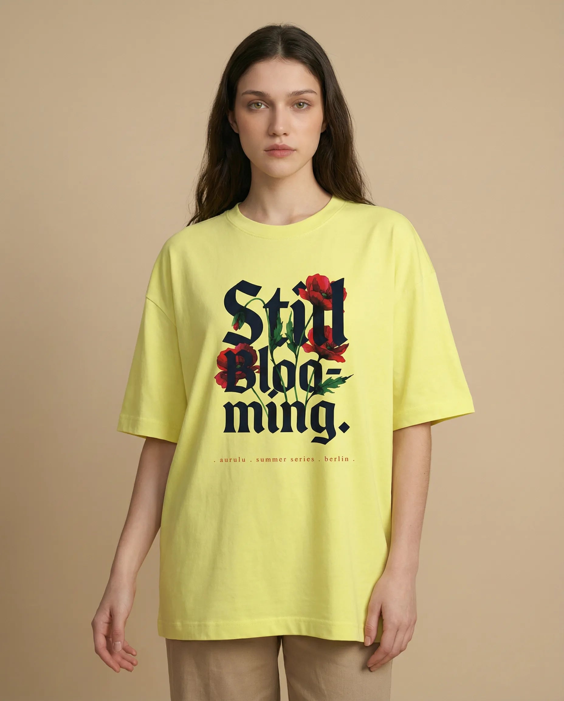 Still Blooming women's oversized tee with floral print from aurulu, showcasing relaxed fit and vibrant design.