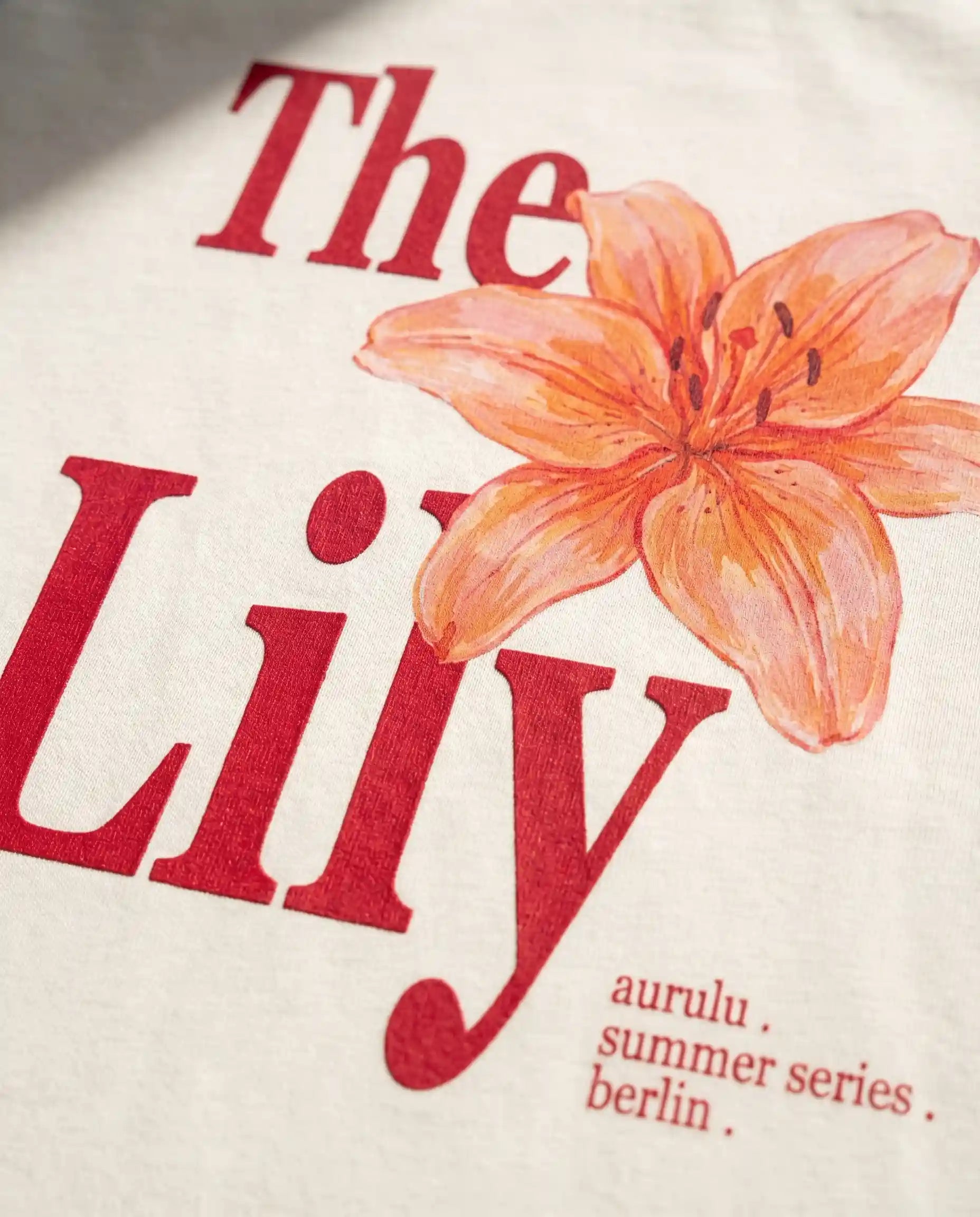 Pink oversized women's T-shirt with floral print from aurulu's The Lily collection, casual and comfortable for everyday wear