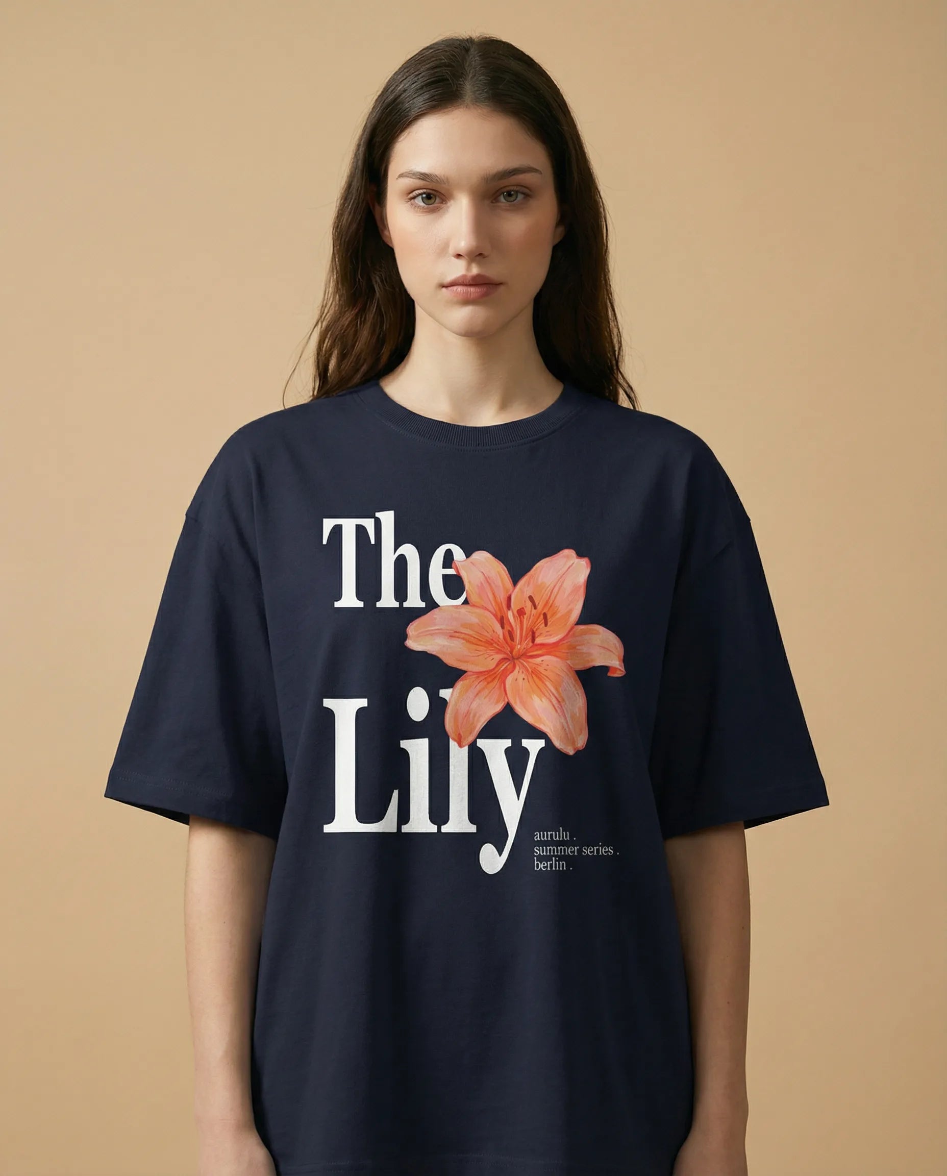 Black oversized women's tee with colorful floral print from aurulu's The Lily collection, casual and comfortable fit.