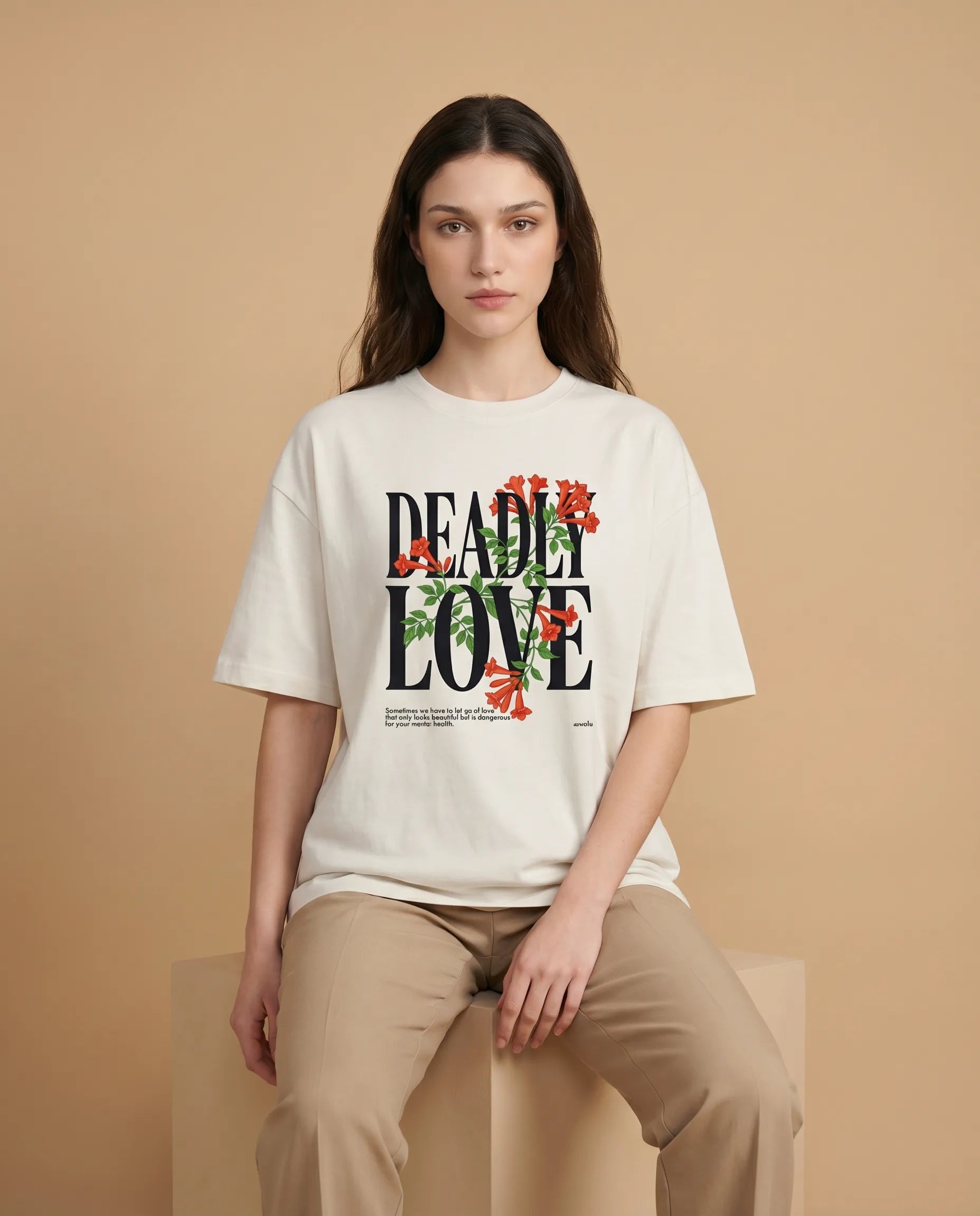 Deadly Love Women's oversized print tee by aurulu, featuring bold graphic design on soft fabric, displayed on a hanger.