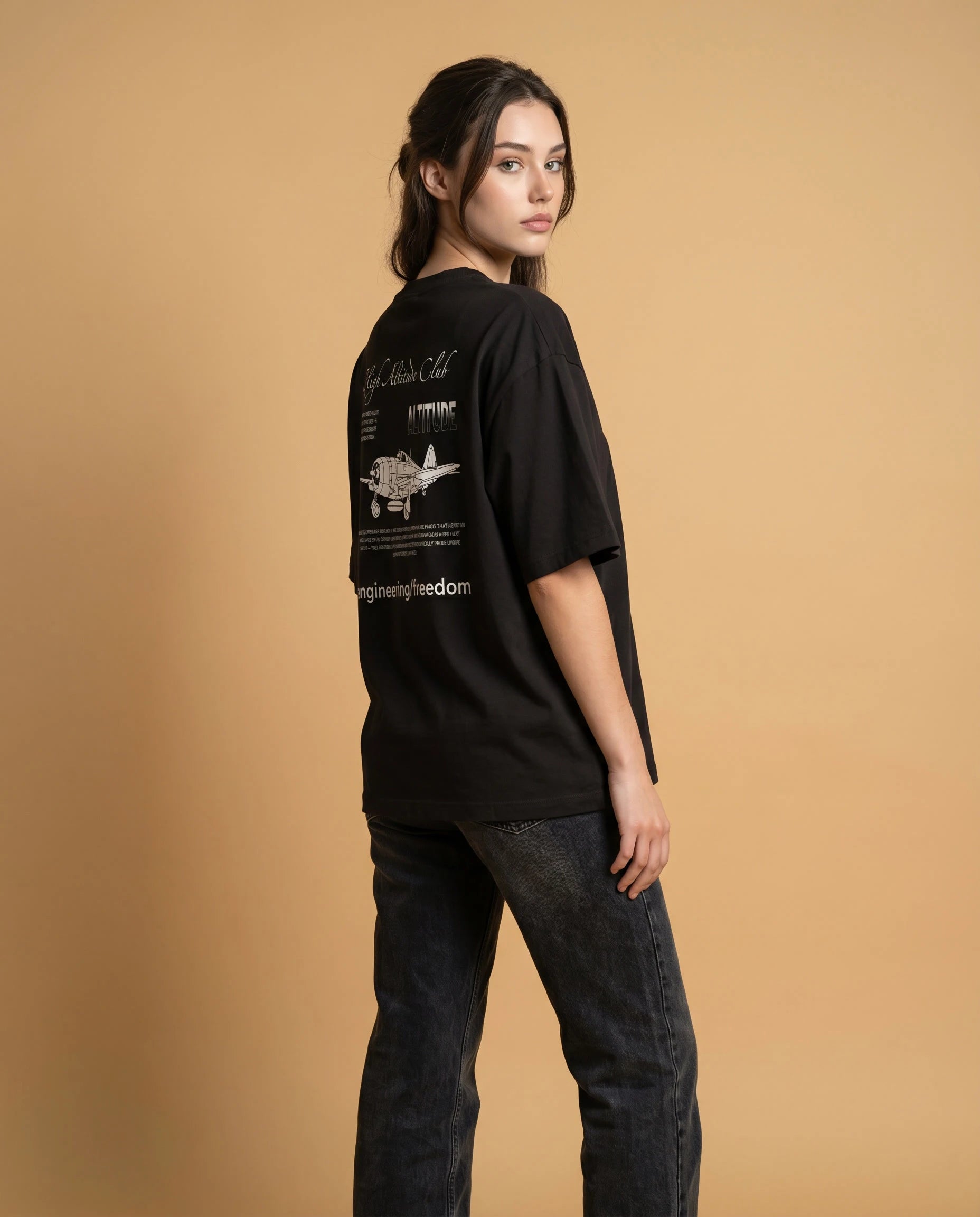 Unisex oversized High Altitude Club organic cotton T-shirt with printed design by aurulu, shown in navy blue color.