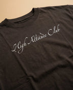 Unisex oversized T-shirt by aurulu with high altitude club print, made from organic cotton, shown in a front view.