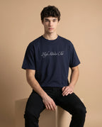 Unisex oversized T-shirt by aurulu made from organic cotton with printed design, shown on a flat surface.